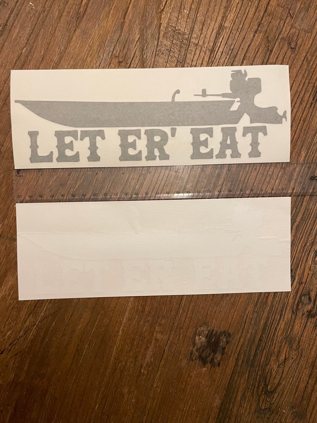 Gray 10" vinyl transfer sticker with "LET ER' EAT" text and a boat design.