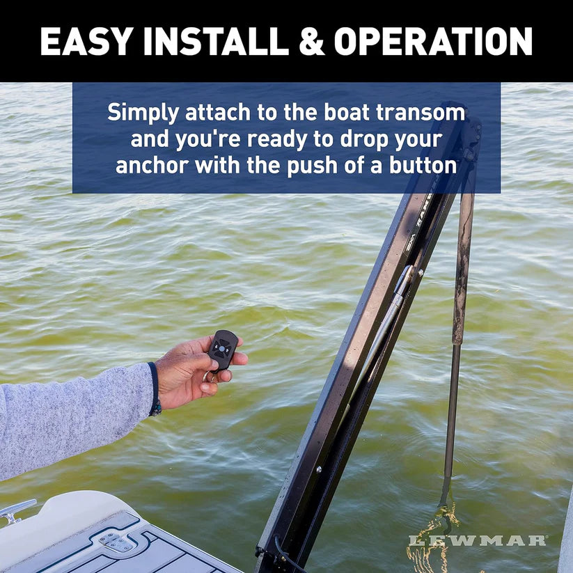 Lewmar Axis Electric Shallow Water Anchor in black, mounted on a boat transom, with a hand holding a remote.