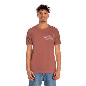 Man wearing a heather clay cotton tee with a white MERC Tiller graphic on the left chest.