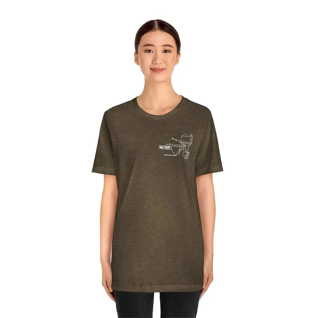 Woman wearing a brown MERC Tiller tee with a white outline graphic of a boat motor on the left chest.