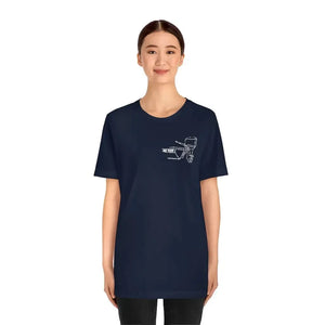 Woman wearing a navy MERC Tiller short sleeve tee with a white outboard motor graphic.