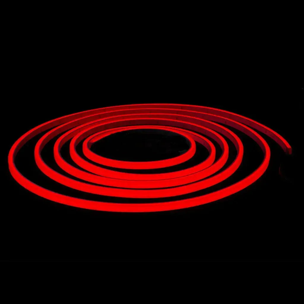 Coiled red MINI LED Neon Flex, emitting a vibrant, continuous glow against a dark background.