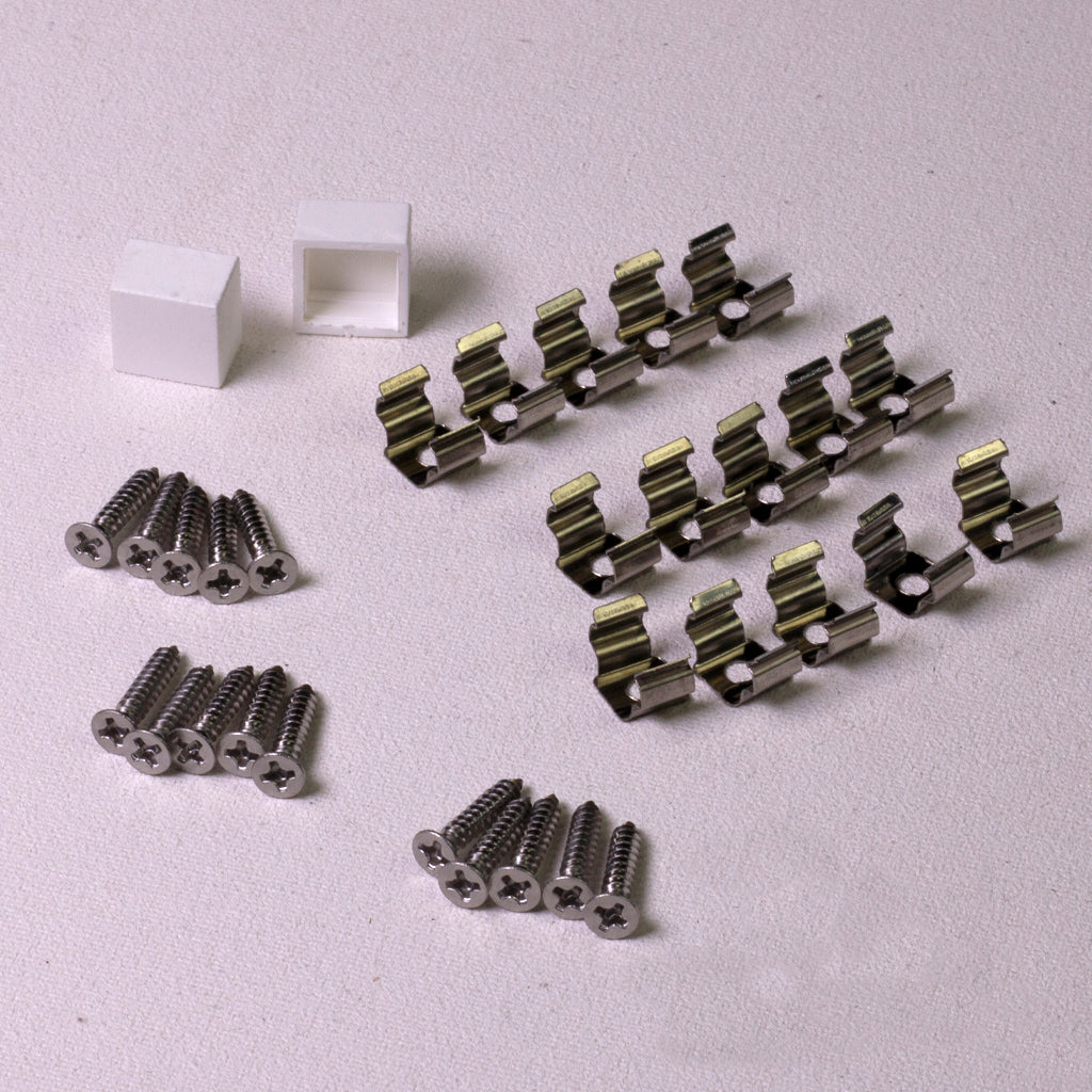White end caps, silver mounting clips, and screws for MINI LED Neon Flex installation.