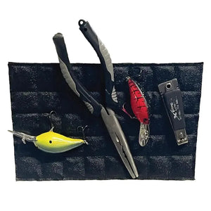 Black Magnalure Pad holding fishing pliers, a yellow lure, a red lure, and snips.