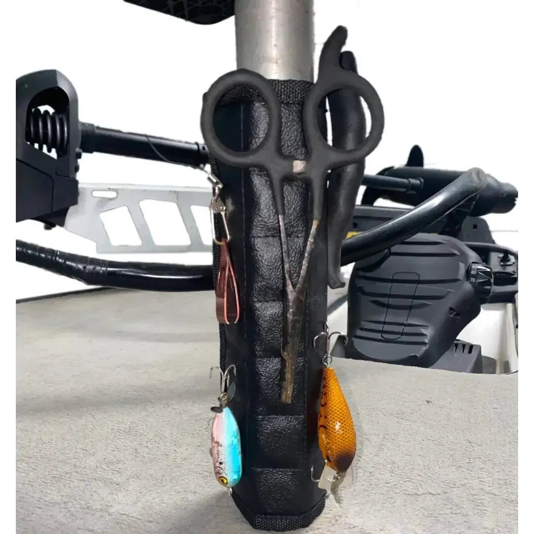 Black Magnalure magnetic wraps on boat pedestals, holding fishing lures, pliers, and scissors.