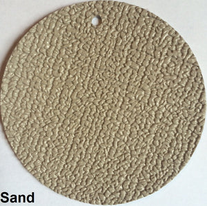 Round sample of MarineDeck 80 mil marine vinyl flooring in Sand, featuring a textured, slip-resistant surface.