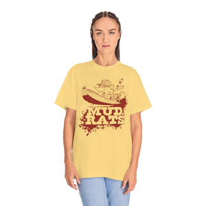 Woman wearing a relaxed-fit, light yellow Mud Rats t-shirt with a red graphic of a rat in a boat.