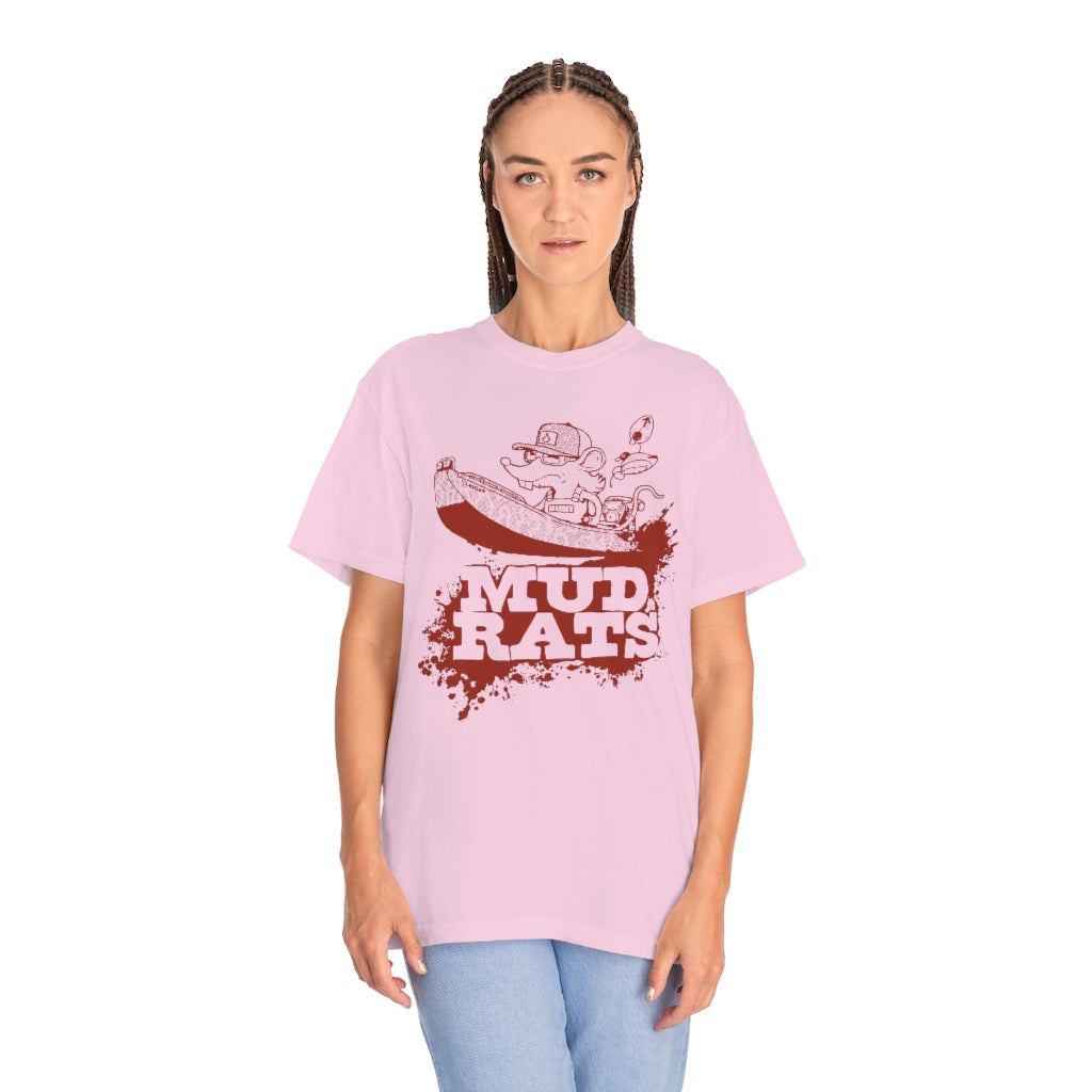 Woman wearing a light pink Gildan Mud Rats t-shirt with a cartoon rat in a boat and red splatter design.