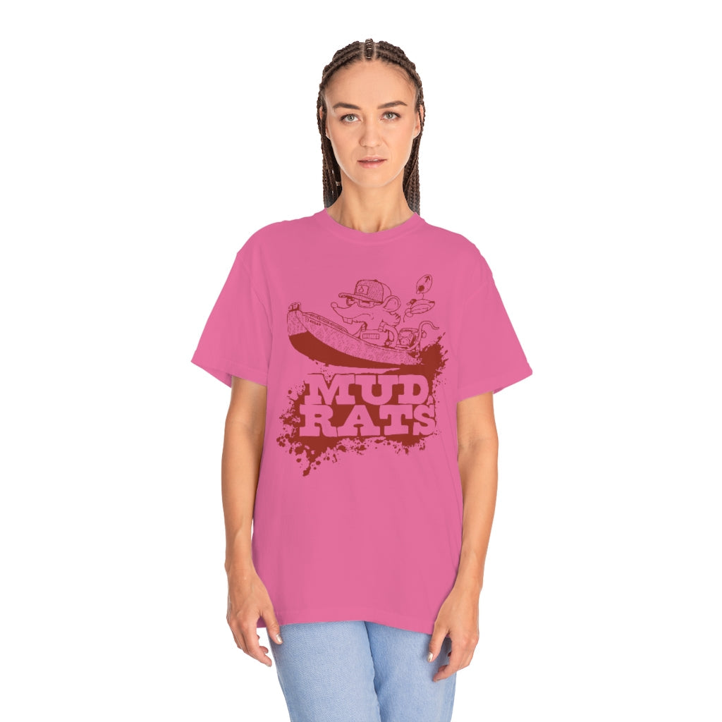 Woman wearing a pink Gildan Mud Rats t-shirt with a cartoon rat in a boat and brown text.