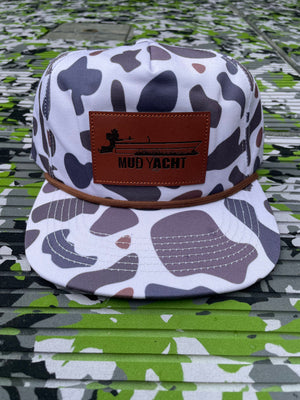 White camo rope hat with a brown leather "Mud Yacht" patch featuring a boat silhouette.
