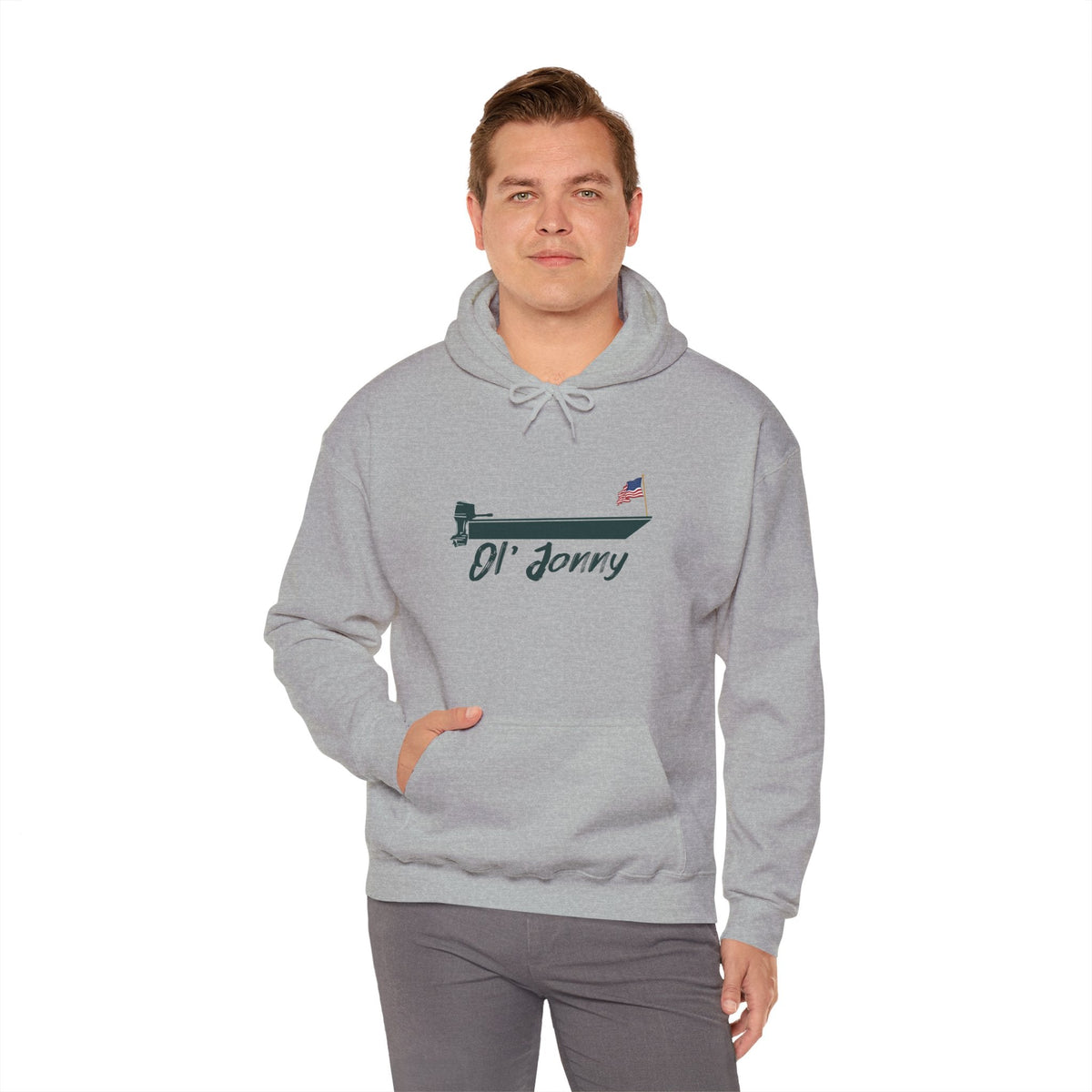 Man wearing a light gray Ol' Jonny Hoodie with a boat graphic and American flag, featuring a kangaroo pocket.