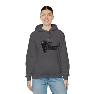 Woman wearing a charcoal grey Ol' Smokey Hoodie with a 2-stroke engine graphic.