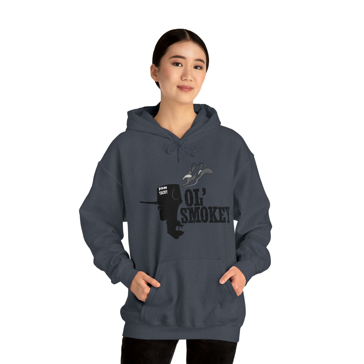 Woman wearing a dark gray Ol' Smokey Hoodie with a classic fit and a 2-stroke engine graphic.