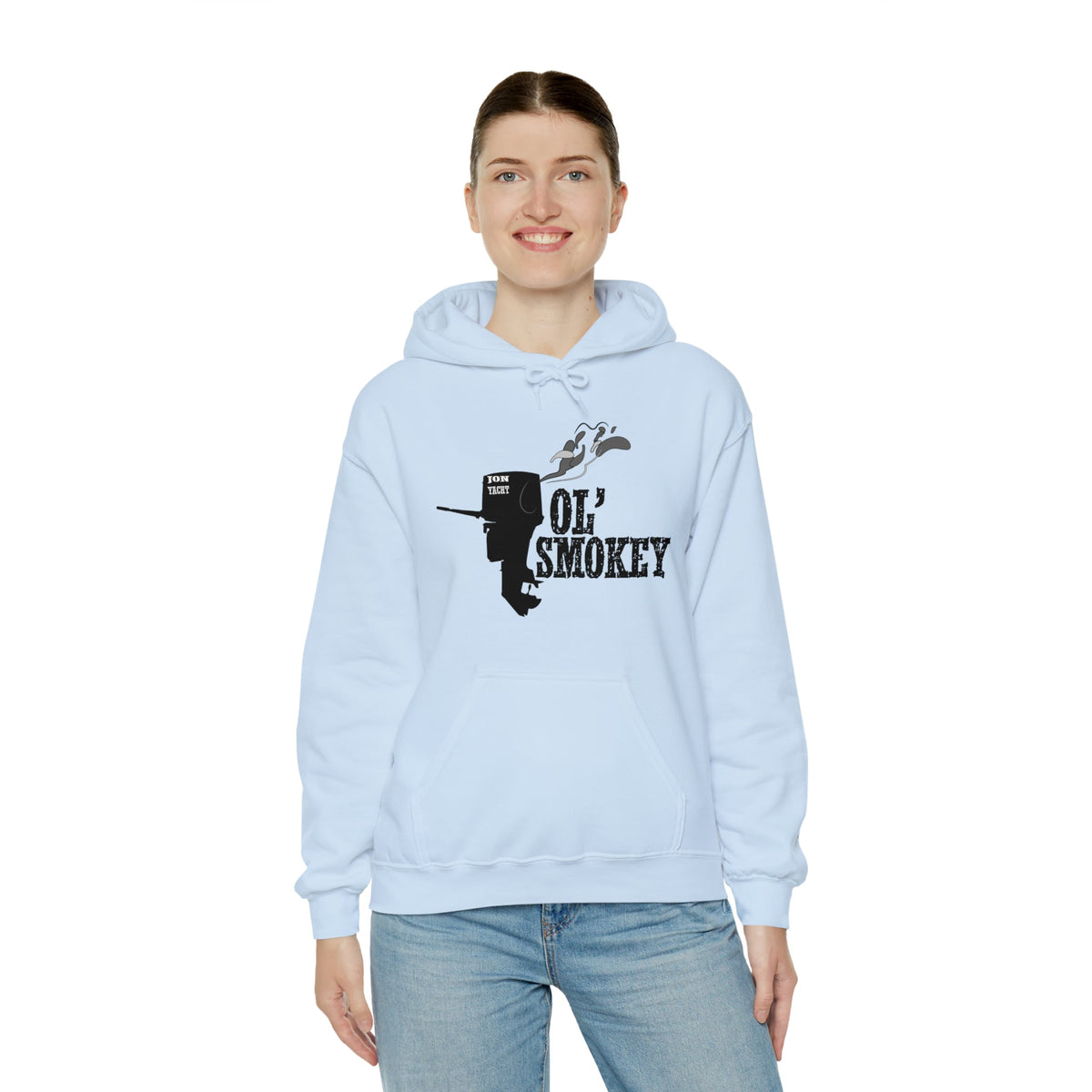 Light blue Ol' Smokey Hoodie with a black two-stroke engine graphic and text, worn by a smiling woman.