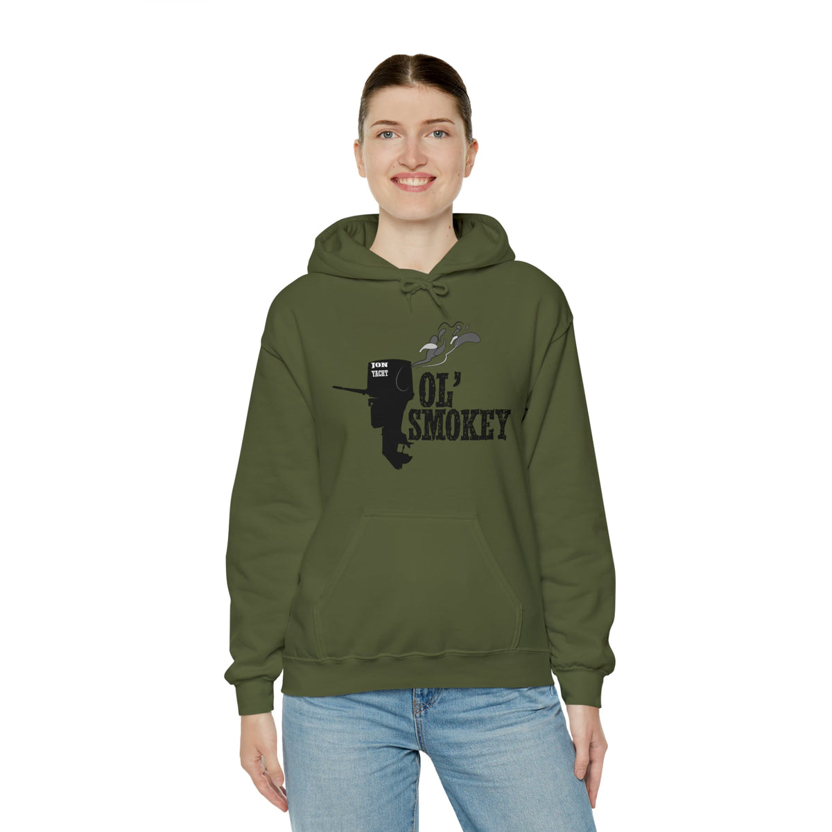 Woman wearing an olive green Ol' Smokey Hoodie with a 2-stroke engine graphic.