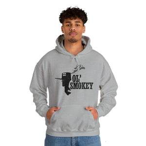 Man in a light grey Ol' Smokey Hoodie with a black two-stroke engine graphic and text.