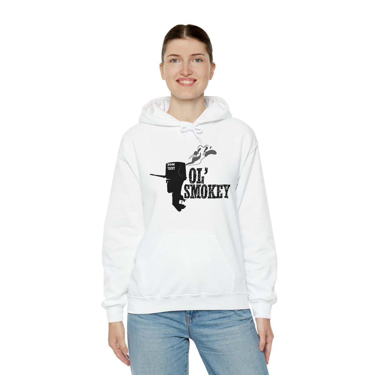 Woman wearing a white Ol' Smokey Hoodie with a black two-stroke engine graphic.