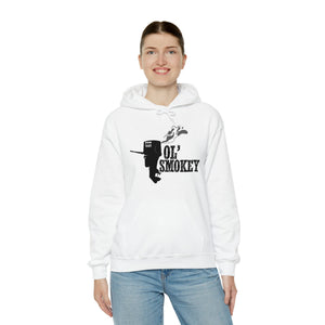 Woman wearing a white Ol' Smokey Hoodie with a black two-stroke engine graphic.