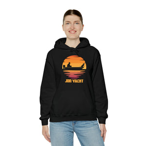 Woman smiling in a black cotton-polyester hoodie with a "JON YACHT" sunset boat graphic and kangaroo pocket.