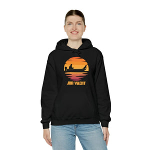 Woman smiling in a black cotton-polyester hoodie with a "JON YACHT" sunset boat graphic and kangaroo pocket.
