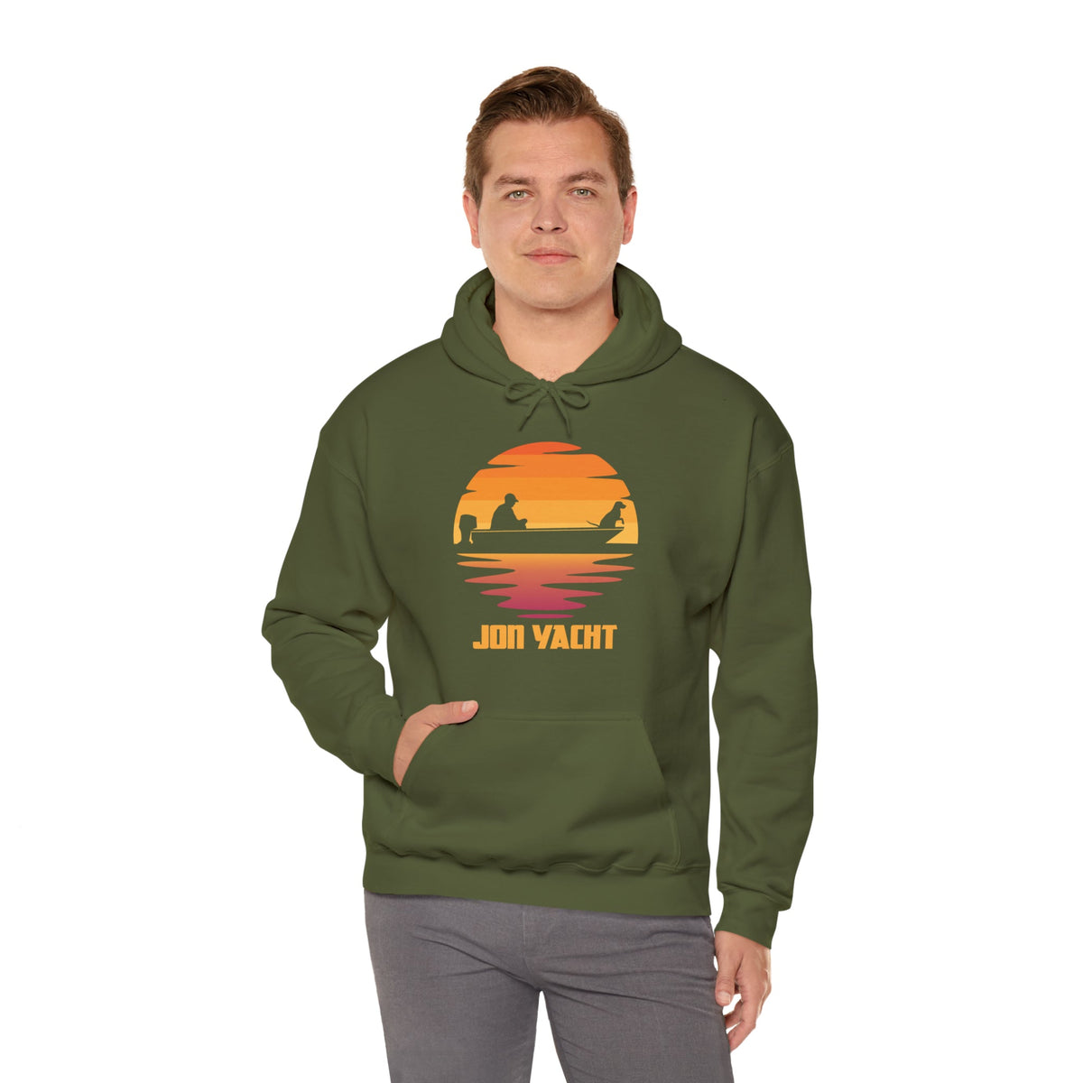 Man wearing an olive green hoodie with a sunset graphic featuring "JON YACHT" text and a kangaroo pocket.
