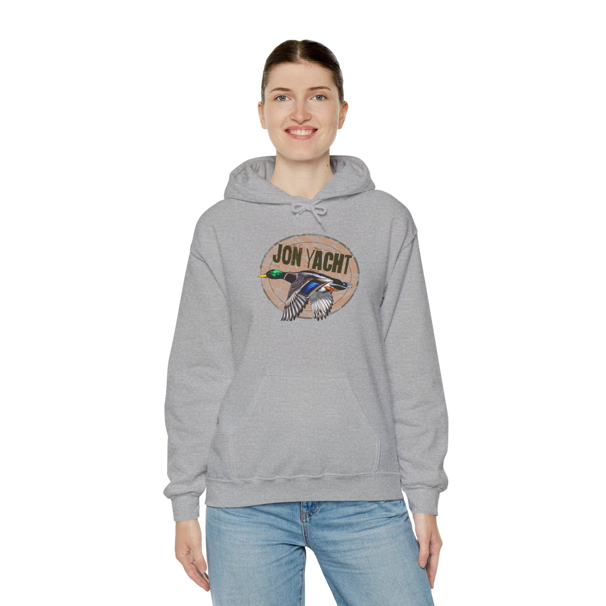 Woman wearing a gray cotton-polyester hoodie with a "JON YACHT" logo and a flying duck graphic.