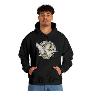 Man in black cotton-polyester hoodie with "Don Yacht Outfitters" duck logo, kangaroo pocket, and matching drawcord.