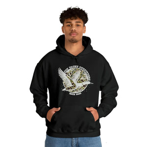 Man in black cotton-polyester hoodie with "Don Yacht Outfitters" duck logo, kangaroo pocket, and matching drawcord.