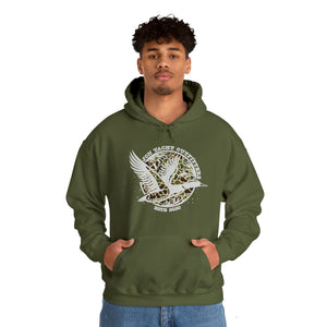 Man wearing an olive green "Old School Ducks" heavy blend hooded sweatshirt with a white duck graphic.