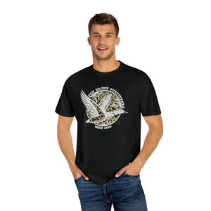 Man in black Comfort Colors t-shirt with "Jon Yacht Outfitters" duck logo on a camo circle.
