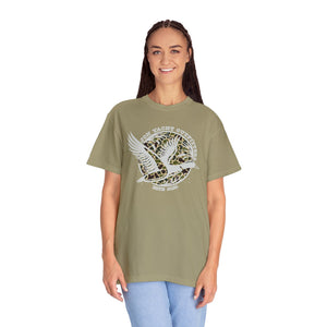 Woman smiling in a relaxed fit, garment-dyed olive t-shirt with a white duck and leopard print design.