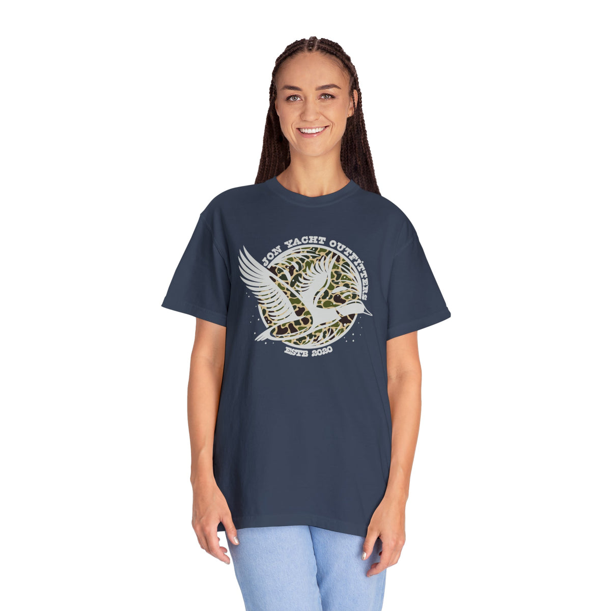 Woman in a navy blue Comfort Colors t-shirt with a white duck and leopard print "Jon Yacht Outfitters" logo.