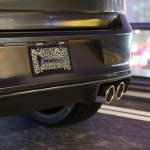 Aluminum Old Skool Plate with camouflage pattern, "SOM YACHT" text, and "NY 2020" on a black car.
