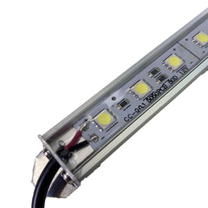 Close-up of a silver aluminum 16" linear waterproof RGB LED channel light with exposed wiring.