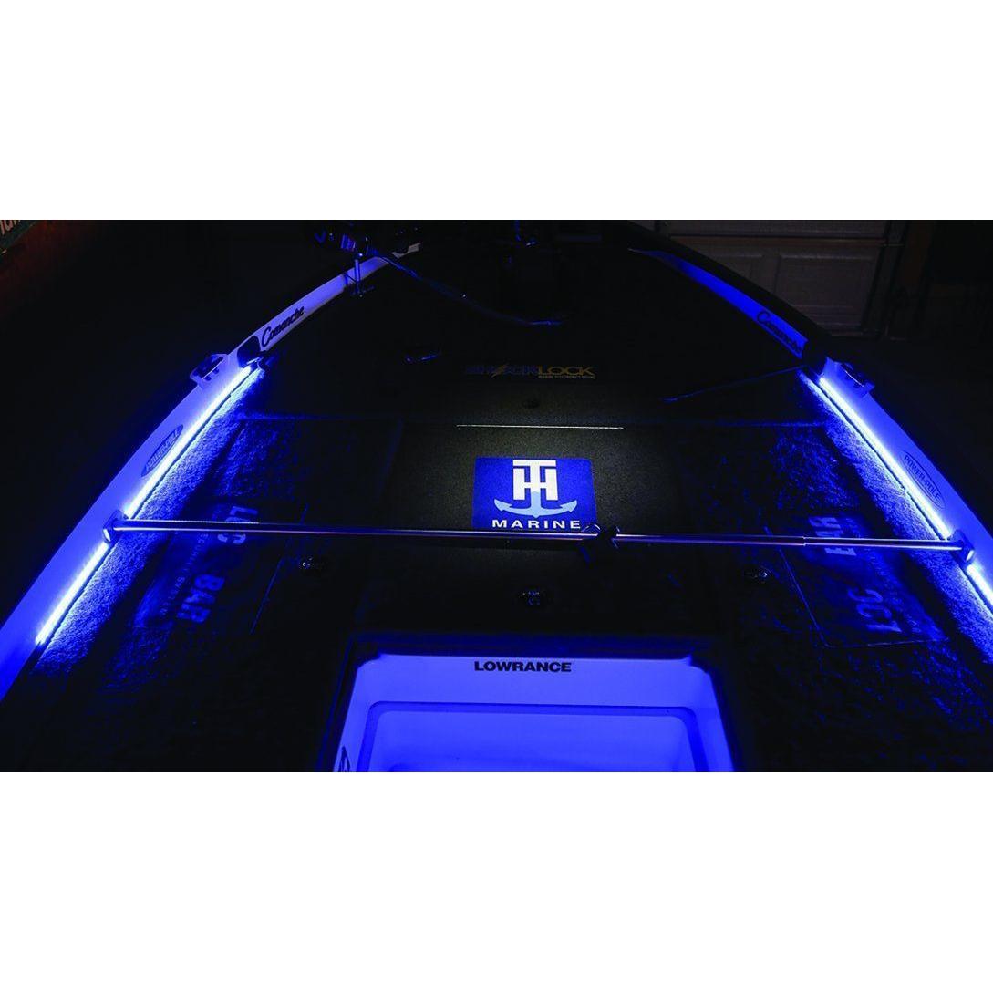 Boat interior illuminated with blue PlashLights LED strips, a glowing "HH Marine" logo, and a Lowrance display.