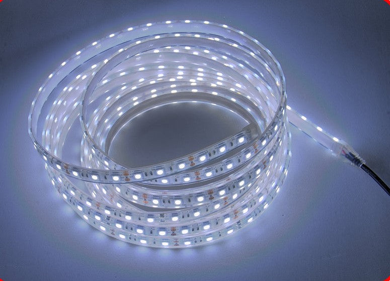 Coiled PlashLights waterproof flexible white LED light strip, IP68 rated, with visible individual LEDs.