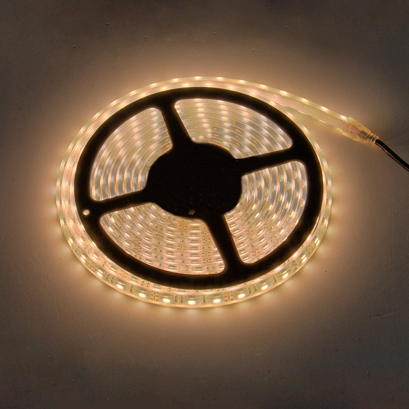 Coiled PlashLights waterproof flexible LED light strip, glowing warm white.