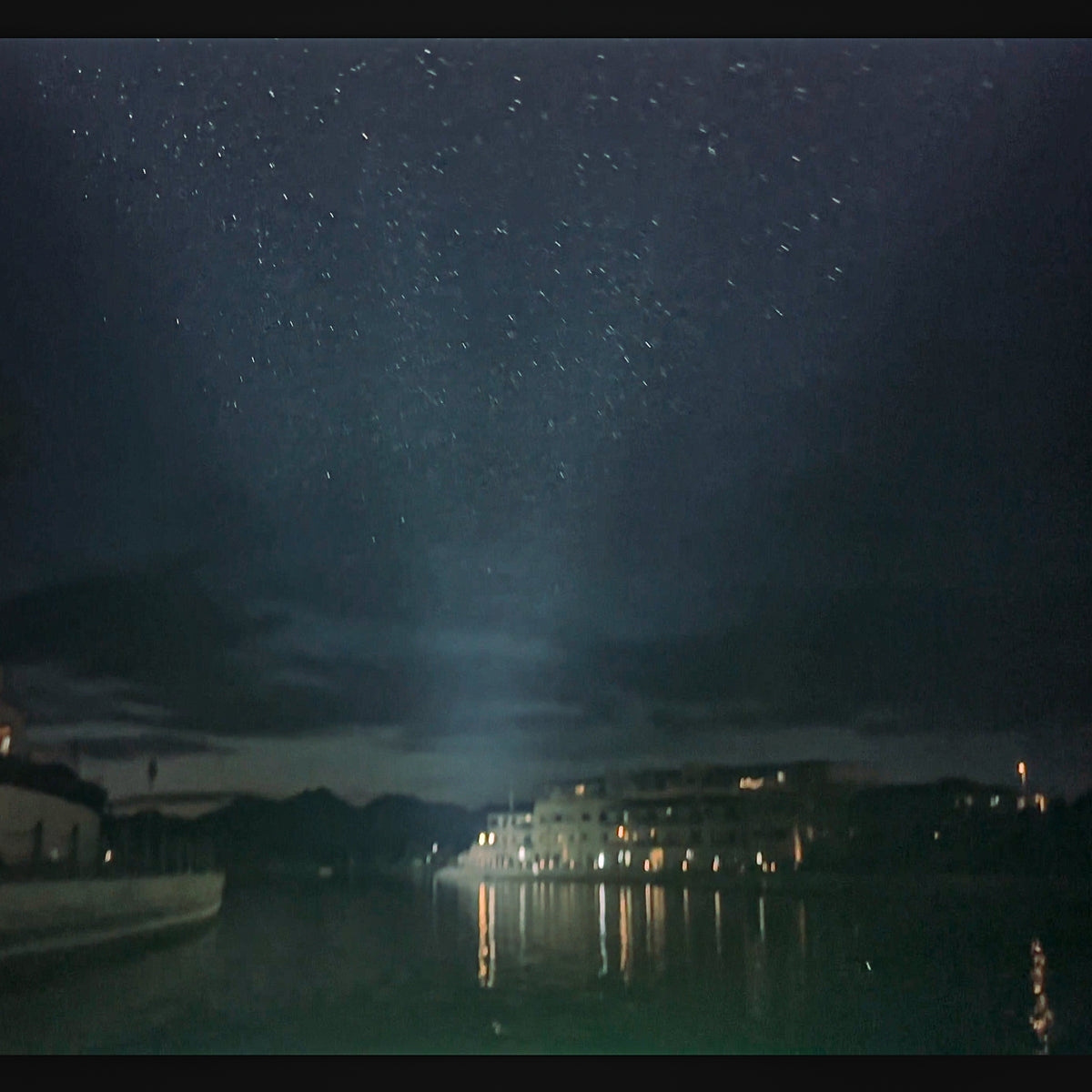 Plashlight SRX2 LED light bar illuminating a boat on water under a starry night sky.