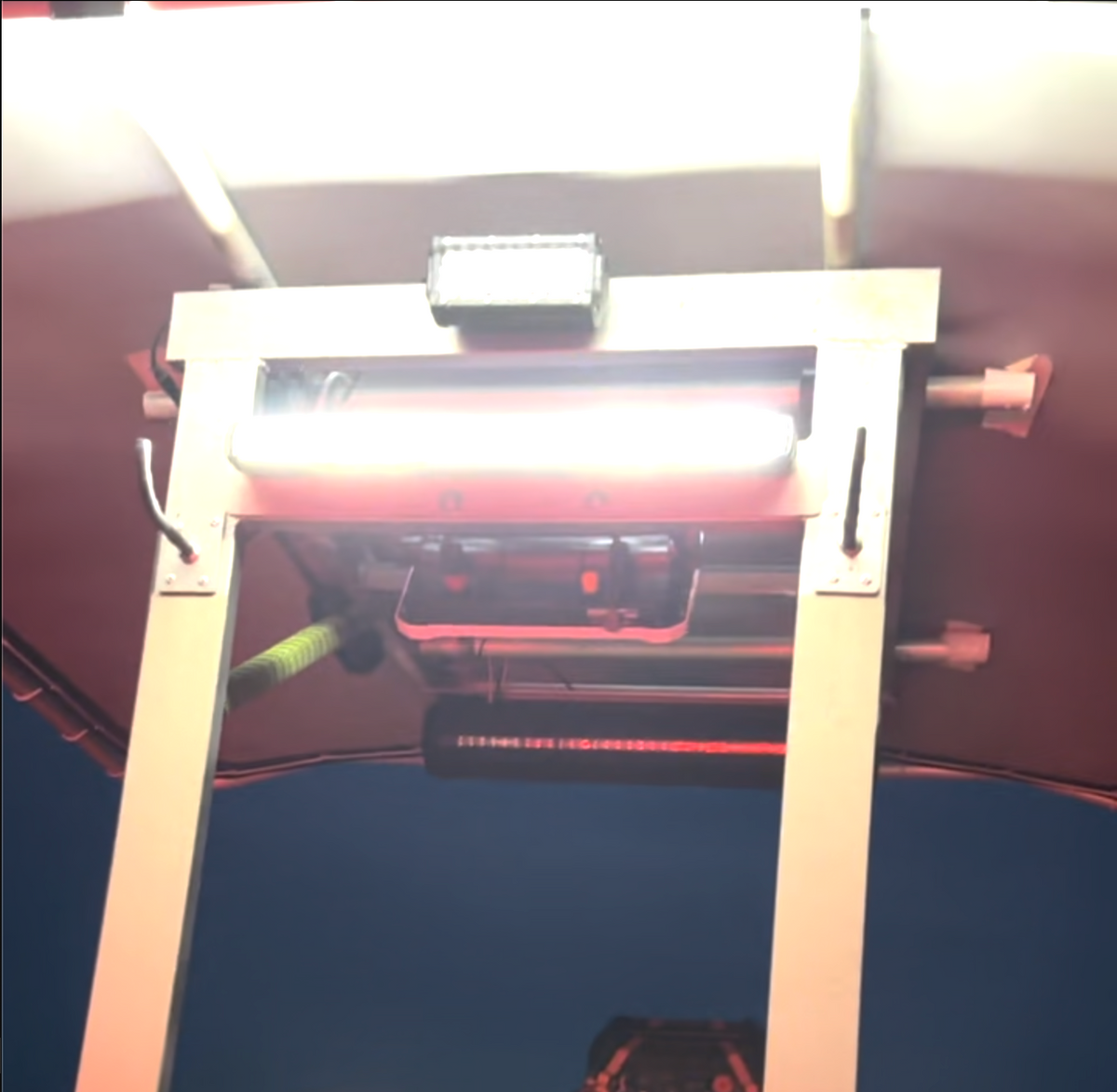 Plashlight SRX2 single row LED light bar, black extruded aluminum, mounted on a boat's T-top.
