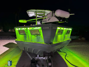 SRX2-Series single row LED light bar illuminating a boat's bow with bright green light.