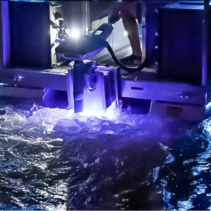 Plashlights EPIK underwater transom light illuminating water with a brilliant blue glow from a boat.