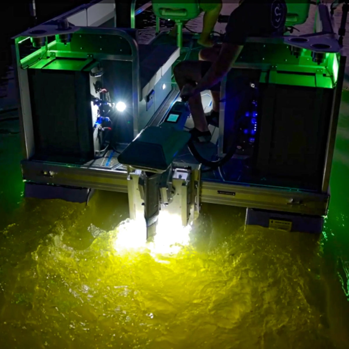Plashlights EPIK underwater transom lights illuminating murky water with a brilliant yellow glow.