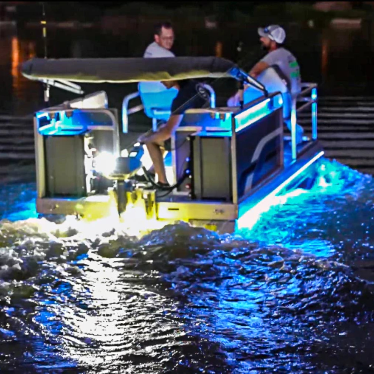 Plashlights EPIK underwater transom lights illuminating a boat's wake with brilliant blue and yellow LED glow.