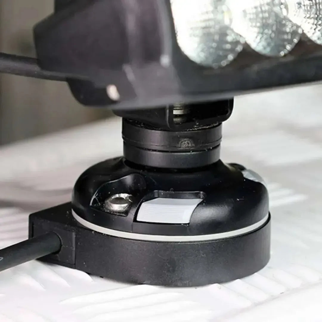 Black Railblaza E Series Cable Entry Port Base with gray cap, screw, and three black rubber cable inserts.