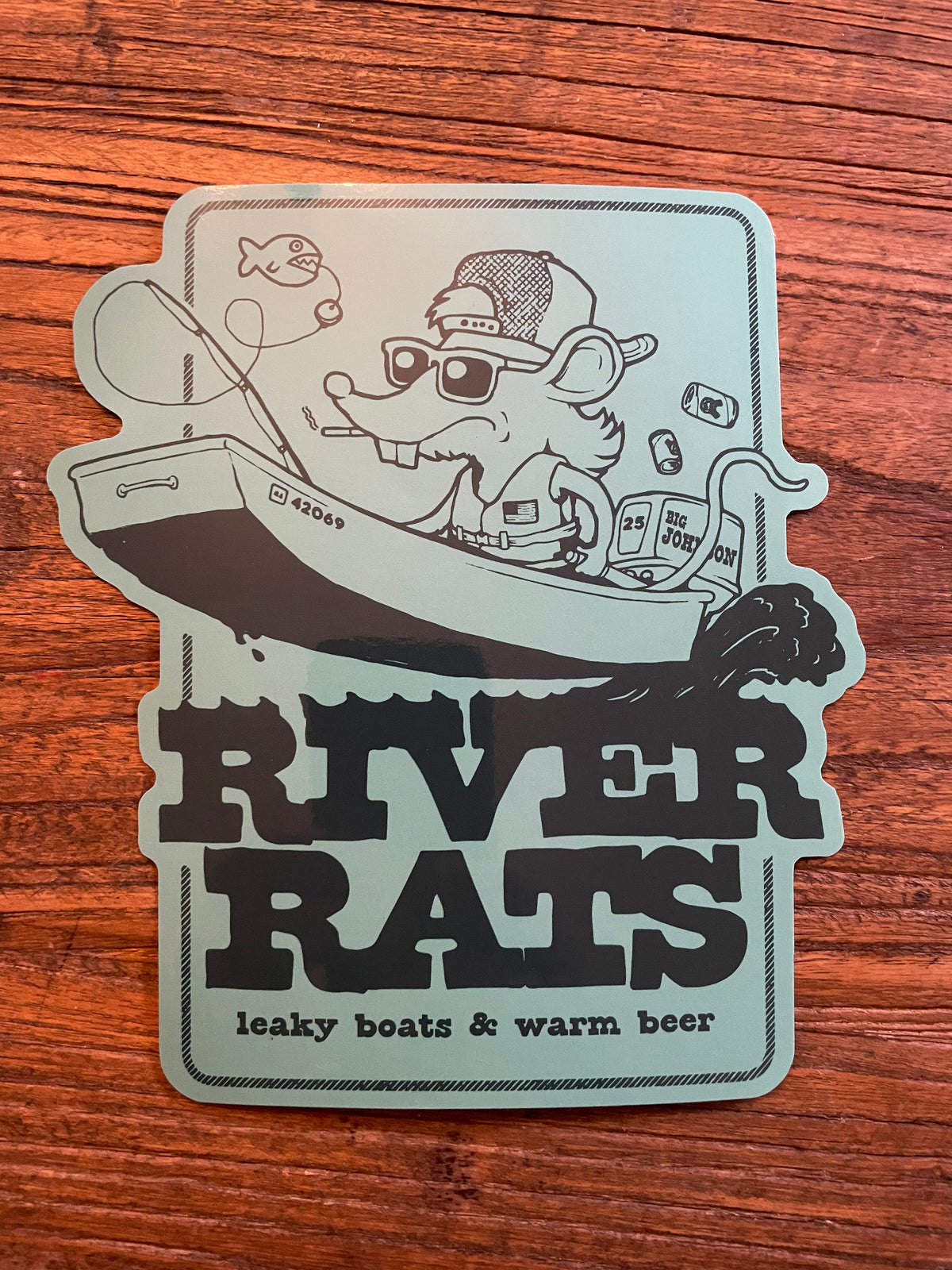 Mint green River Rats 6" decal with a rat fishing from a boat, "leaky boats &amp; warm beer" text.