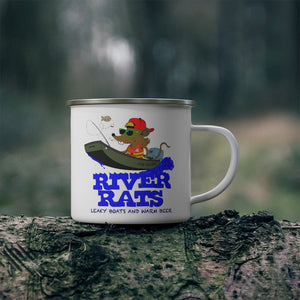 White 12oz enamel mug with a "River Rats" design featuring a rat fishing in a boat, on a log outdoors.