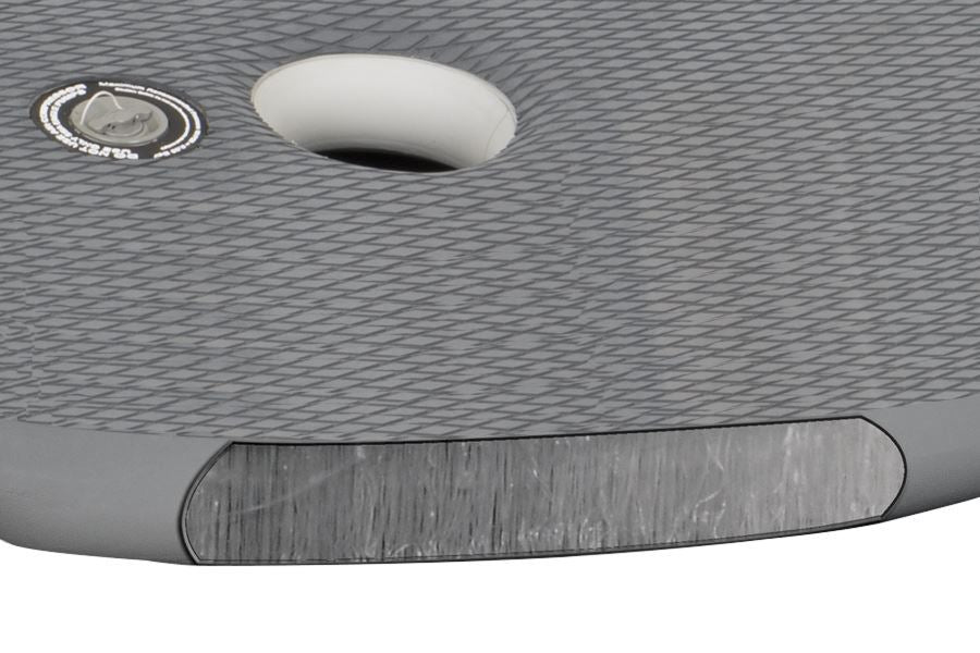Close-up of a gray Sea Eagle 10.6sr inflatable drop stitch floor with textured EVA foam pad and inflation valve.