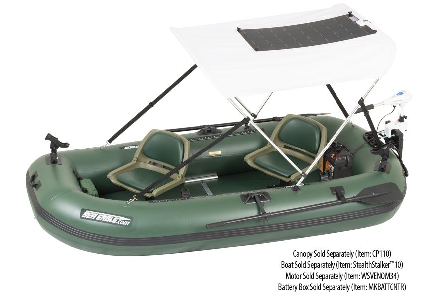 Green inflatable boat with a white canopy featuring a black semi-flexible solar panel.