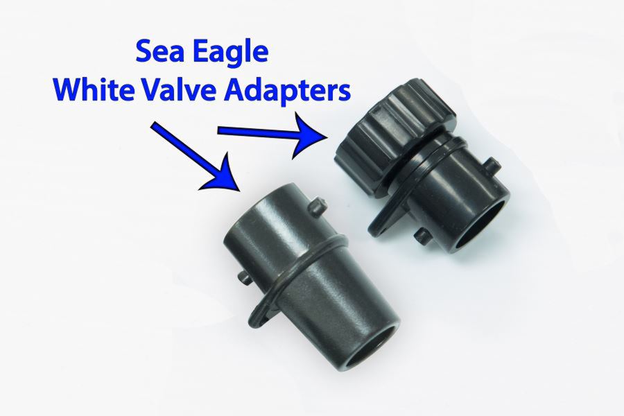 Two black Sea Eagle valve adapters, one with a ribbed screw top, on a white background.