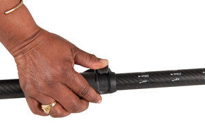 Hand adjusting the black carbon-fiberglass shaft of a Sea Eagle AB51 8' two-part paddle with a lever lock.